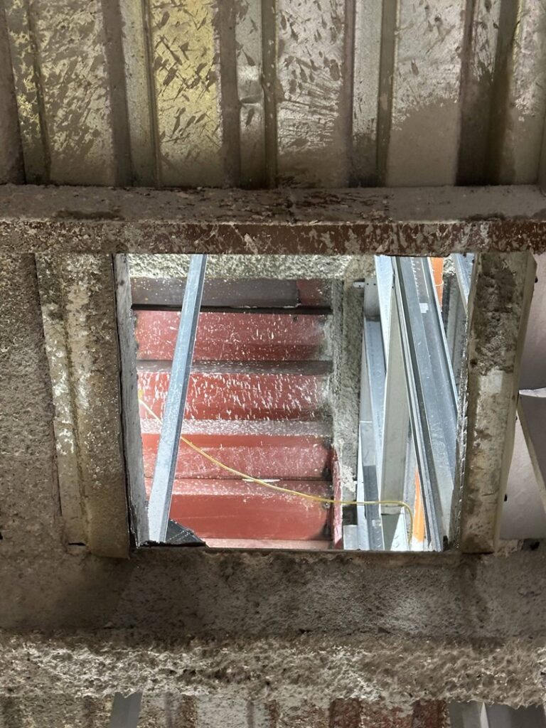 A view looking up through a newly created structural opening in a ceiling by Valute Demolition in Jacksonville, FL.