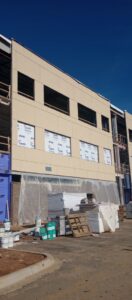Commercial building under construction with stucco, EIFS, and brick siding by Eastern Stucco Restorations in Rock Hill, SC.