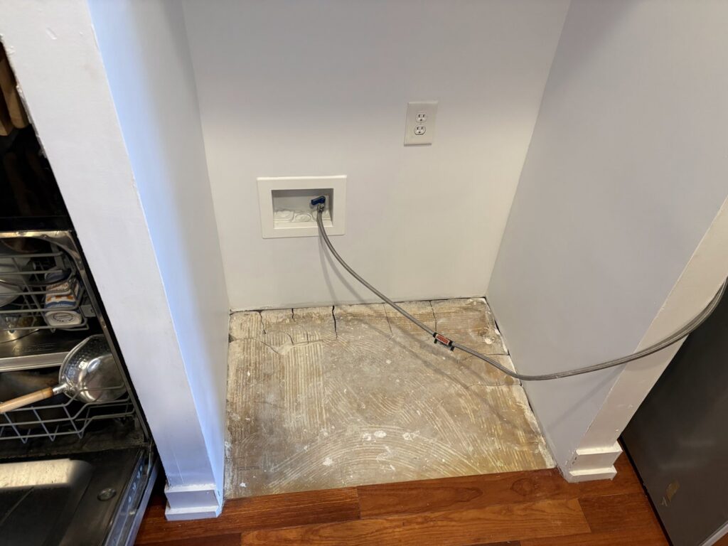 Subfloor exposed with a water line, indicating a leak or water damage repair by NSH Home Services in Jersey City, NJ.