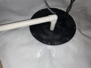 A sump pump installed in a fully encapsulated crawl space by Wetlock Waterproofing in Rock Hill, SC.