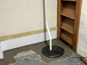 A newly installed sump pump and basement waterproofing system by Basement Doctor of West Virginia in Parkersburg, WV.