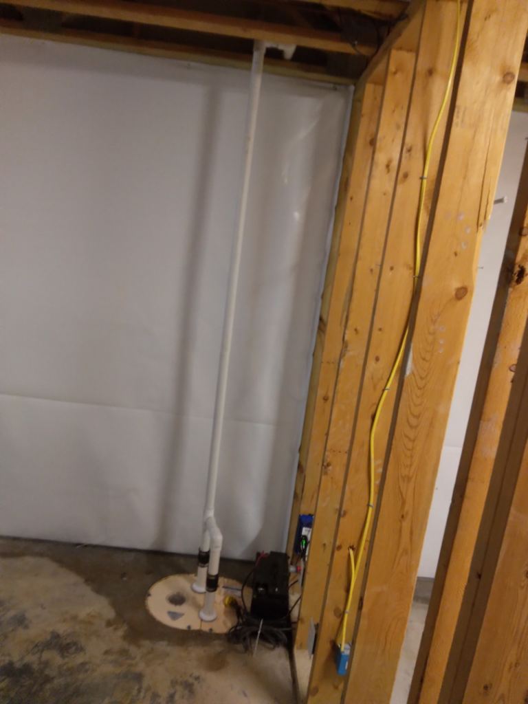A newly installed sump pump system in a crawlspace for effective water damage prevention by Allied Foundation & Crawlspace Solutions in Decatur, AL.