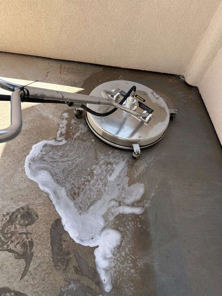 A professional surface cleaner in action on a concrete patio by Farki Pressure Washer LLC in Mesquite, NV