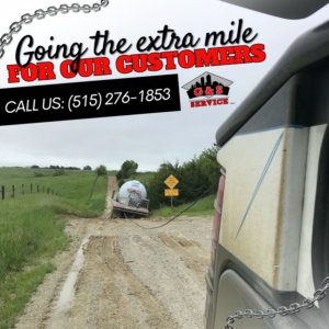 G & S Towing Service, Inc. recovering a tanker truck stuck in a muddy ditch in Des Moines, IA.