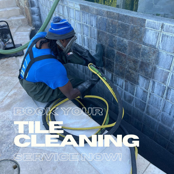 A Premier Pool Service technician in Gulfport, MS, expertly cleaning pool tiles with specialized equipment.