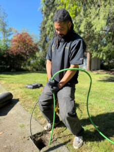 A DNA Drain Cleaning & Sewer technician performing a drain cleaning or inspection service in Tulalip, WA.
