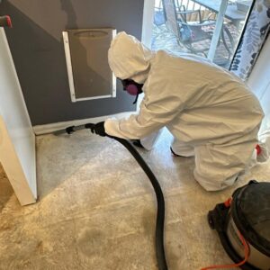 A technician in a hazmat suit performing mold remediation cleanup for Built Different Restoration in Gilbert, AZ.