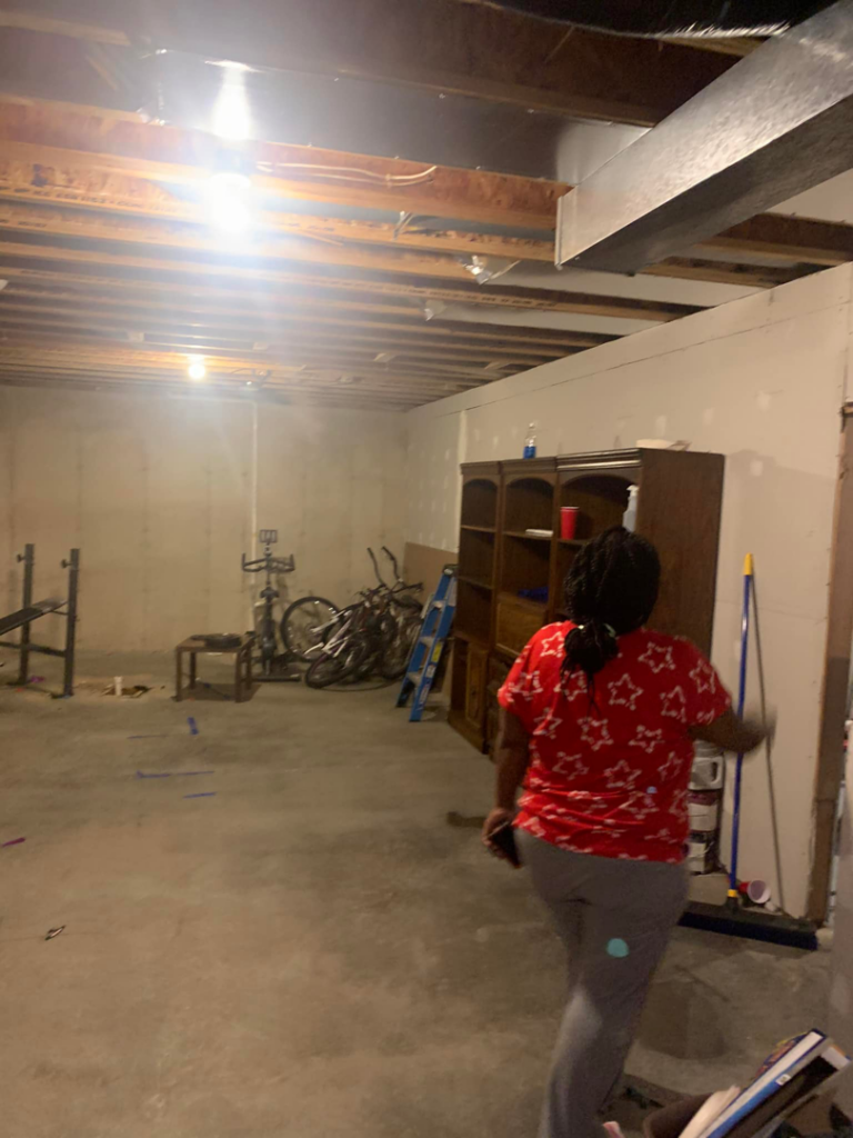 A technician using a moisture meter on a wall to detect water damage for H&H2o Response & Restoration in Janesville, WI