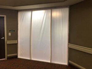 A temporary containment wall set up in a hallway to isolate a work area for water damage restoration by Restoration 1 of OKC in Yukon, OK.
