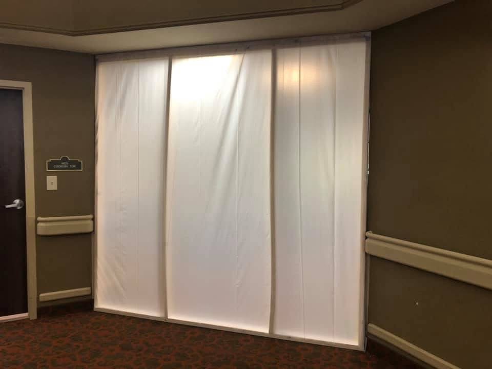 A temporary containment wall set up in a hallway to isolate a work area for water damage restoration by Restoration 1 of OKC in Yukon, OK.