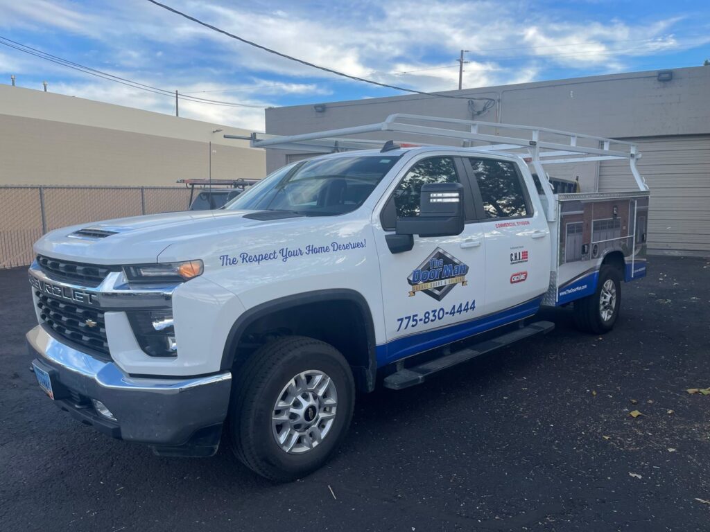 The branded service truck for The Door Man - Garage Doors & Openers, ready for jobs in Reno, NV