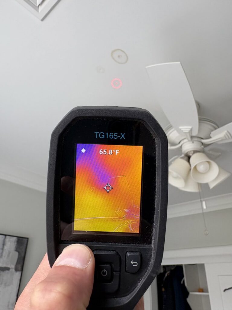 A thermal imaging camera detecting moisture in a ceiling during a water damage inspection by NSH Home Services in Jersey City, NJ.