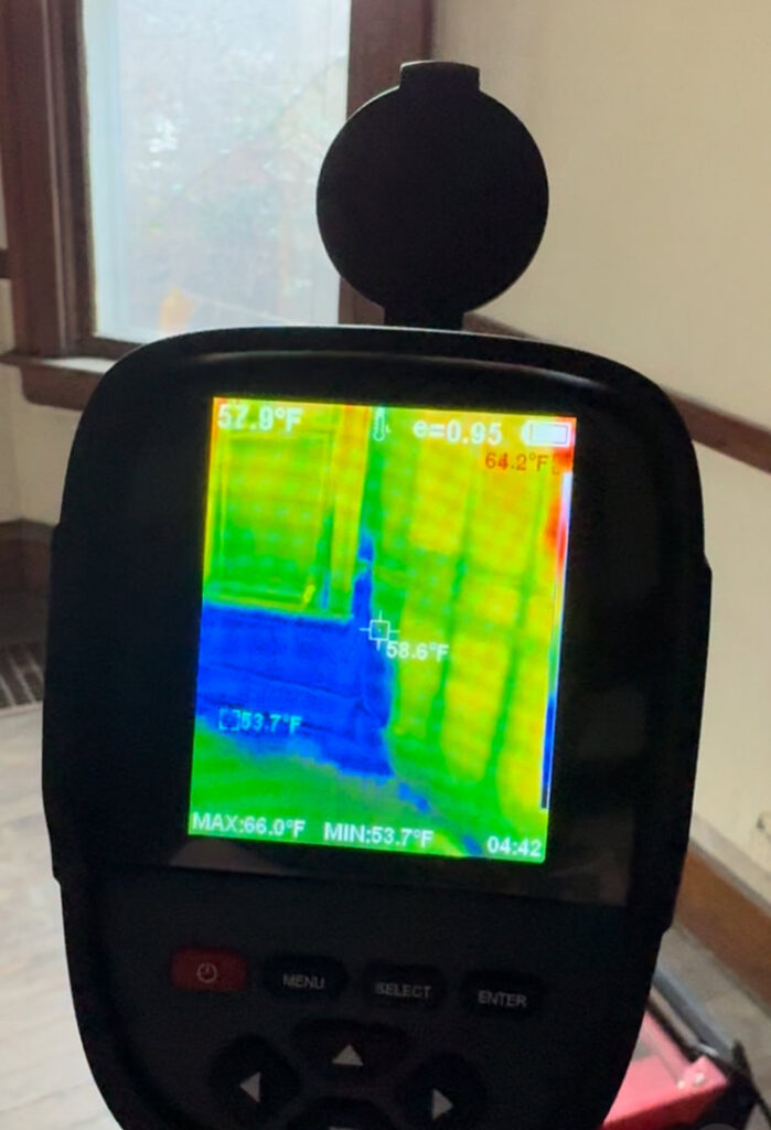 A thermal imaging camera displaying temperature variations, used for moisture detection in water damage assessment by KY Water Damage Restoration in Georgetown, KY.