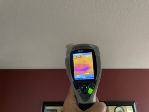 Thermal imaging camera detecting hidden moisture and water damage in a ceiling by Best Dry Flood and Mold Specialists, Inc. San Diego, CA