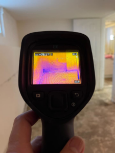 A thermal imaging camera detecting potential water damage in a room for Island Emergency Disaster Restoration in Farmingdale, NY.