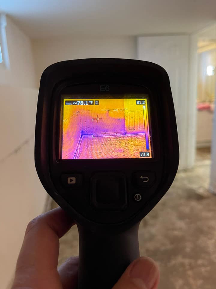 A thermal imaging camera detecting potential water damage in a room for Island Emergency Disaster Restoration in Farmingdale, NY.