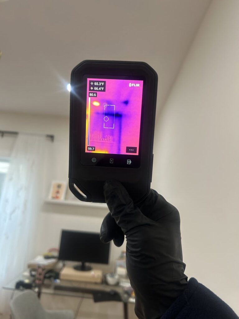 A thermal imaging camera being used to detect hidden water damage by RestoPros Hudson County in Jersey City, NJ.