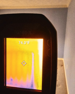 A thermal imaging camera detecting potential moisture or temperature anomalies during water damage assessment by Remont Restoration in Hagerstown, MD.
