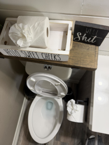 A thoroughly cleaned toilet area in a bathroom, demonstrating the attention to detail from Lupita's cleaning services in San Antonio, TX.