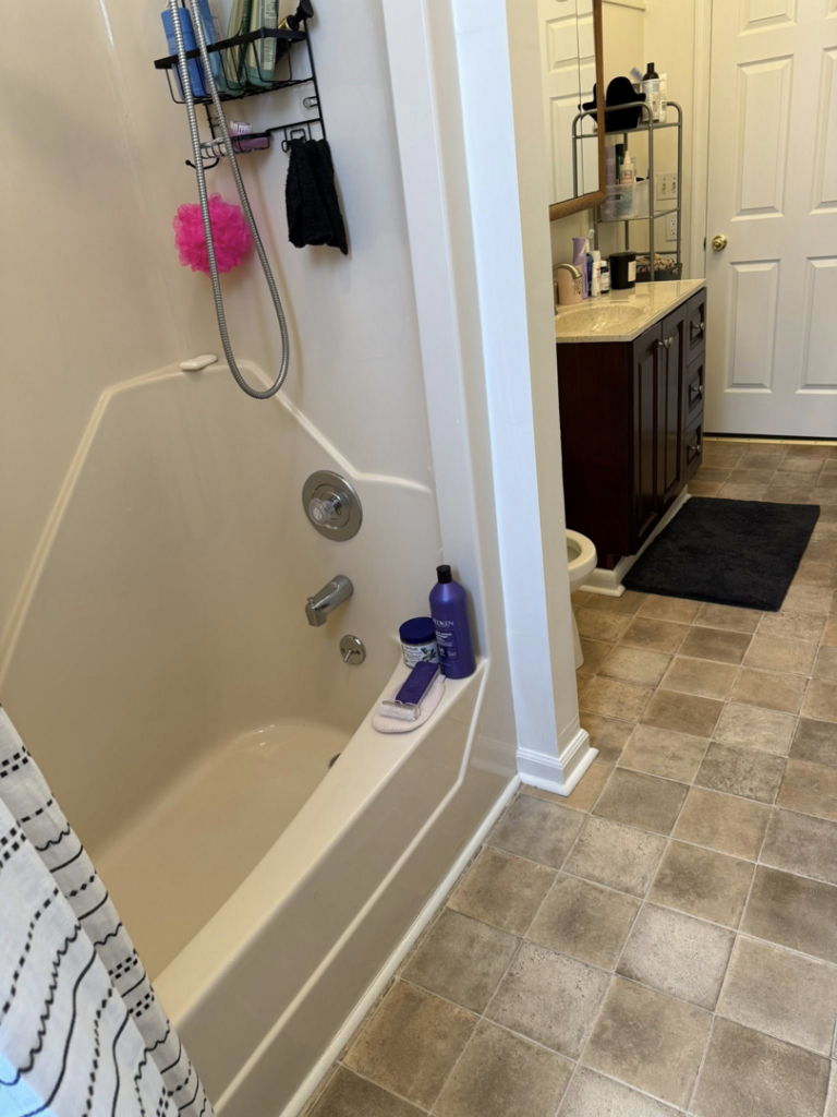 A tidy bathroom featuring a clean bathtub and vanity, expertly cleaned by Spotless Cleaning Operations LLC in Lancaster, PA.
