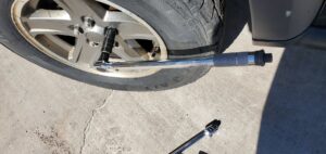 A torque wrench being used on a car's lug nut during a tire service by Liberty Auto Rescue in Colorado Springs, CO.