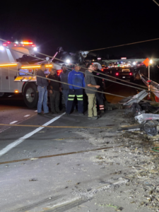 Tow truck and crew at a night accident recovery scene for County Towing & Recovery LLC in West Columbia, SC.