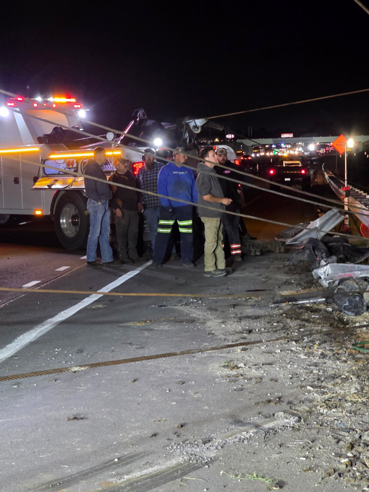 Tow truck and crew at a night accident recovery scene for County Towing & Recovery LLC in West Columbia, SC.