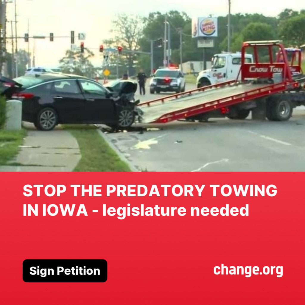 A tow truck from Stop Predatory Towing in Iowa loading a damaged car after an accident in Des Moines, IA.