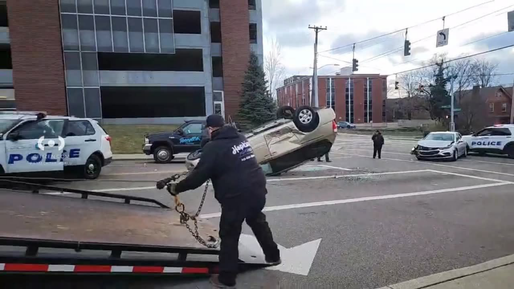 A Hopkins Towing operator recovering an overturned car from an accident scene in Cincinnati, OH.