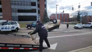 A Hopkins Towing operator recovering an overturned car from an accident scene in Cincinnati, OH.