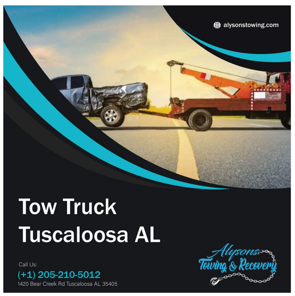 A tow truck from Alyson's Towing pulling a damaged pickup truck on a road in Tuscaloosa, AL.