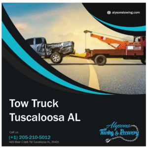 A tow truck from Alyson's Towing pulling a damaged pickup truck on a road in Tuscaloosa, AL.