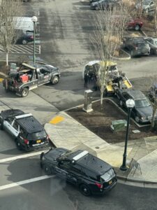 PRO TOW tow trucks and police at a vehicle recovery operation in Beaverton, OR.
