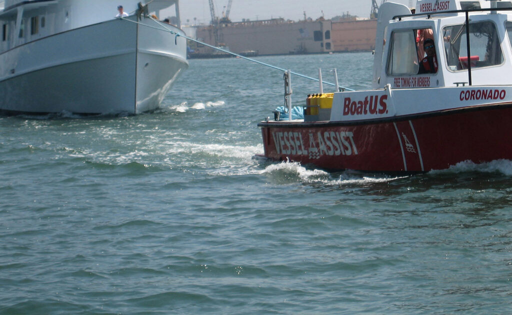 A TowBoatUS San Diego vessel actively towing another boat on the water in San Diego, CA.