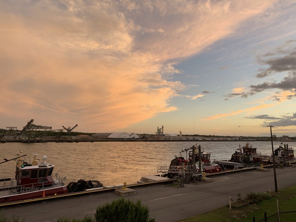 Myrick Marine Contracting Corp.'s fleet of tugboats and barges docked along the river in Norfolk, VA.