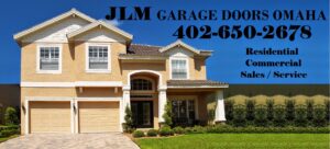 A residential home showcasing two new brown garage doors with decorative windows and hardware from JLM Garage Doors Omaha in Papillion, NE.