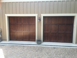 Two dark brown panel garage doors installed by Advantage Door Company in Troy, MO.