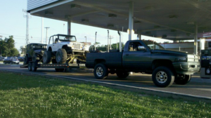 Two Jeeps being transported on a trailer by Jr & Sr towing and recovery in Waukegan, IL.