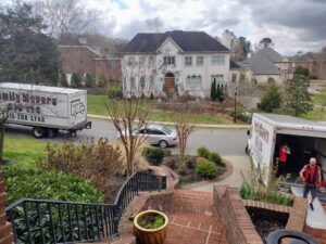 Two Family Movers 615 LLC trucks parked at a residential home for a moving job in Goodlettsville, TN.