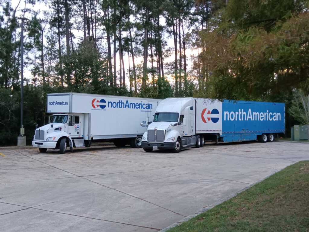 Two North American moving trucks parked, ready for service by Peroulas Moving and Storage in Knoxville, TN