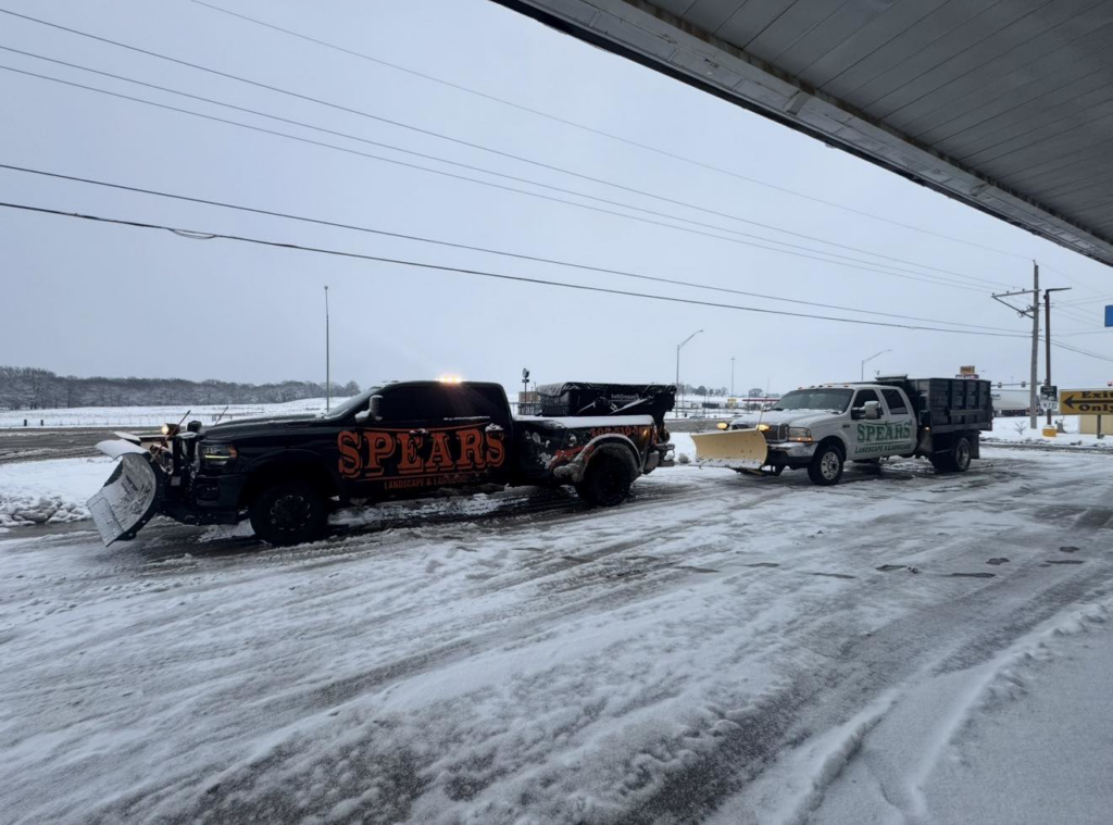 Two snow plow trucks from Spears Landscape & Lawncare ready for snow removal in Midwest City, OK.