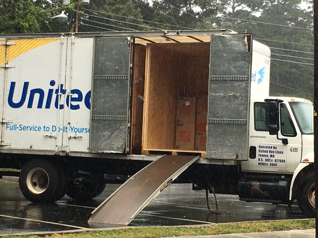 A United moving truck with its ramp down, ready for loading or unloading by The Armstrong Company in Huntsville, AL.