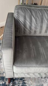 Close-up of a freshly cleaned grey velvet sofa by Cleaning Service Masters LLC in Escondido, CA