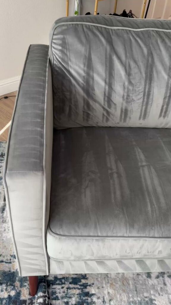 Close-up of a freshly cleaned grey velvet sofa by Cleaning Service Masters LLC in Escondido, CA
