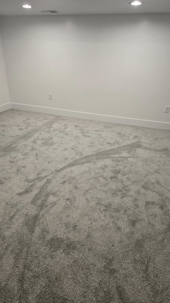 A freshly vacuumed carpeted room with clear vacuum lines, showcasing the detailed cleaning service by Best Kingdom Cleaning LLC in Spokane, WA.