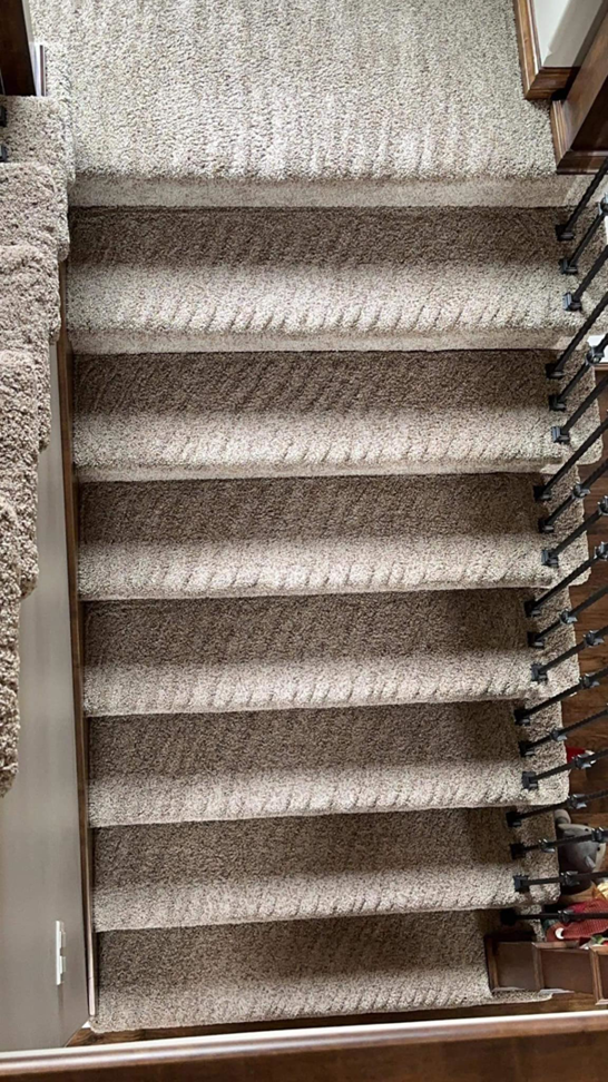 Freshly vacuumed carpeted stairs showing clean lines, a service provided by Yeilys Cleaning Services LLC in Omaha, NE.