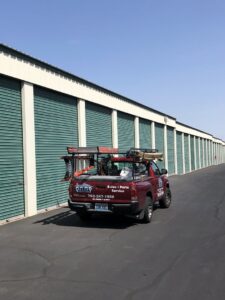 Valley Overhead Door's service truck parked at a storage facility with roll-up doors in Las Vegas, NV.