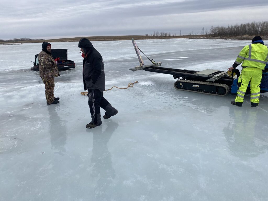 Jim & Ron's Service Inc. performing a vehicle recovery from a frozen lake in Sioux Falls, SD.