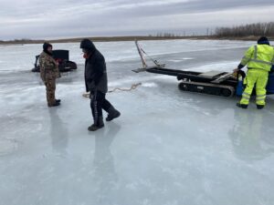 Jim & Ron's Service Inc. performing a vehicle recovery from a frozen lake in Sioux Falls, SD.