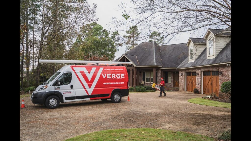 A Verge Entrance Solutions van and worker at a residential garage door job site by Jonathan at Verge in Hattiesburg, MS.